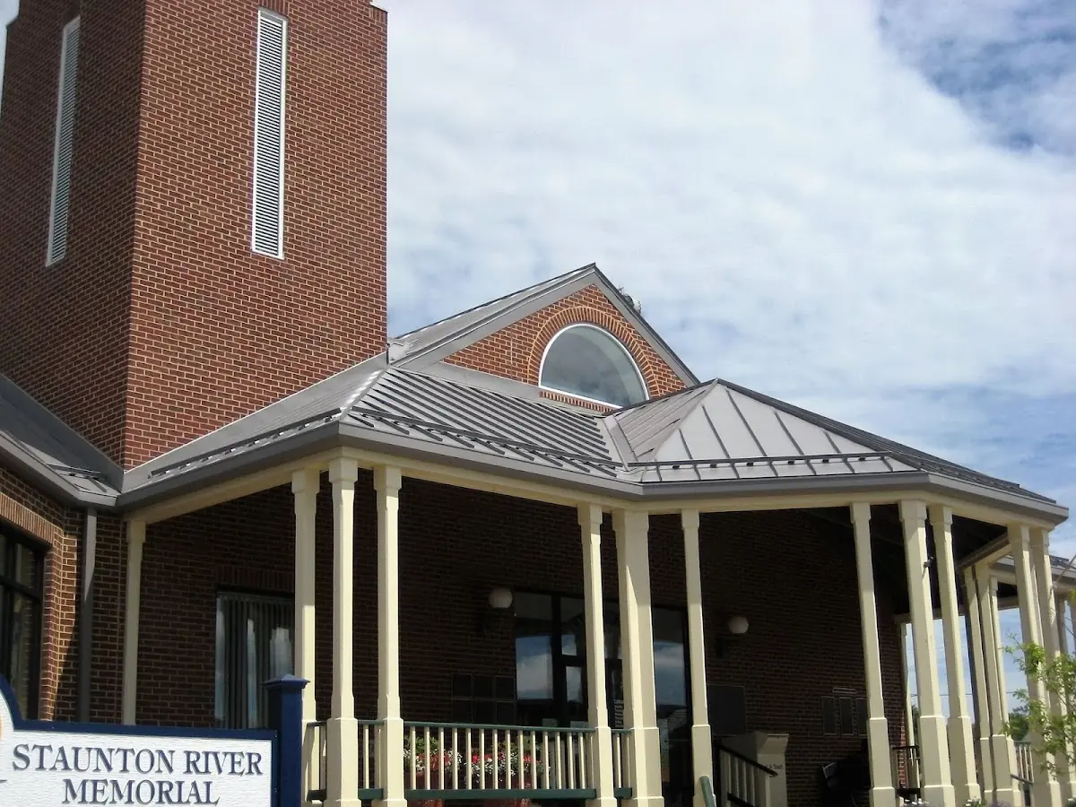 Skilled roofing craftsmen working on a residential roof in Rockingham